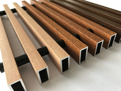 wood-imitating aluminum grates